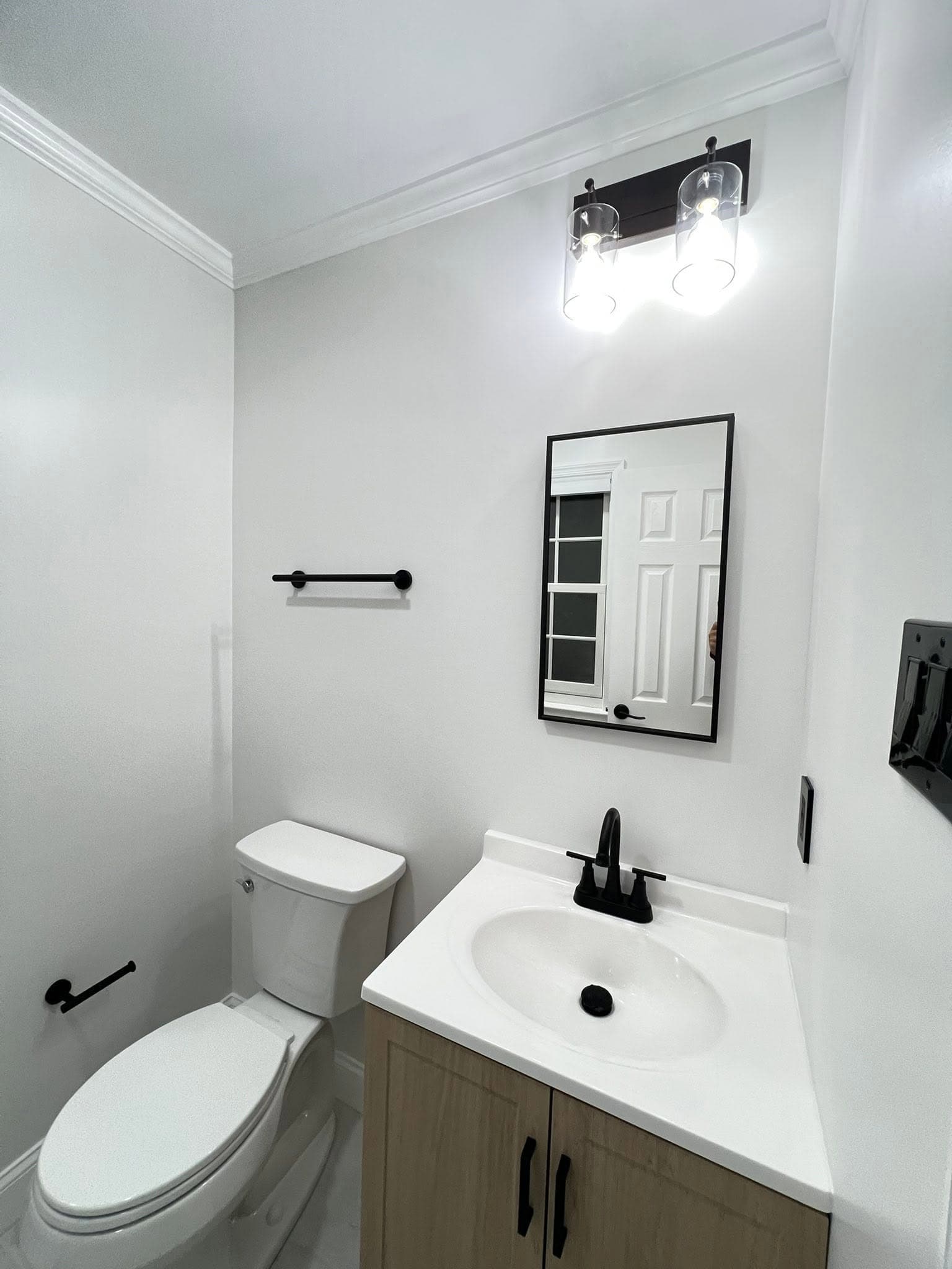 Compact bathroom with glass shower, after view 2