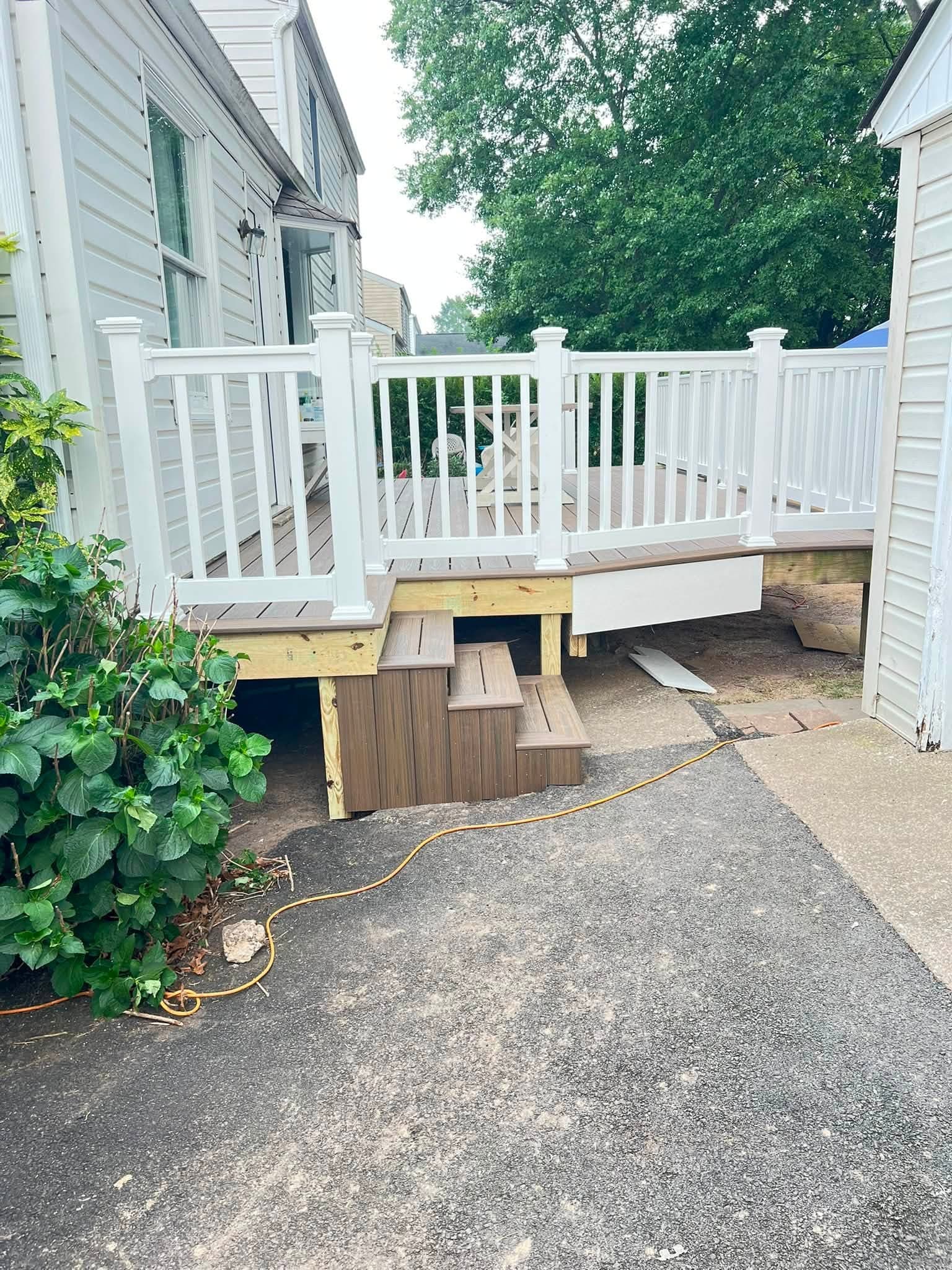 Covered deck with white railings, after view 2