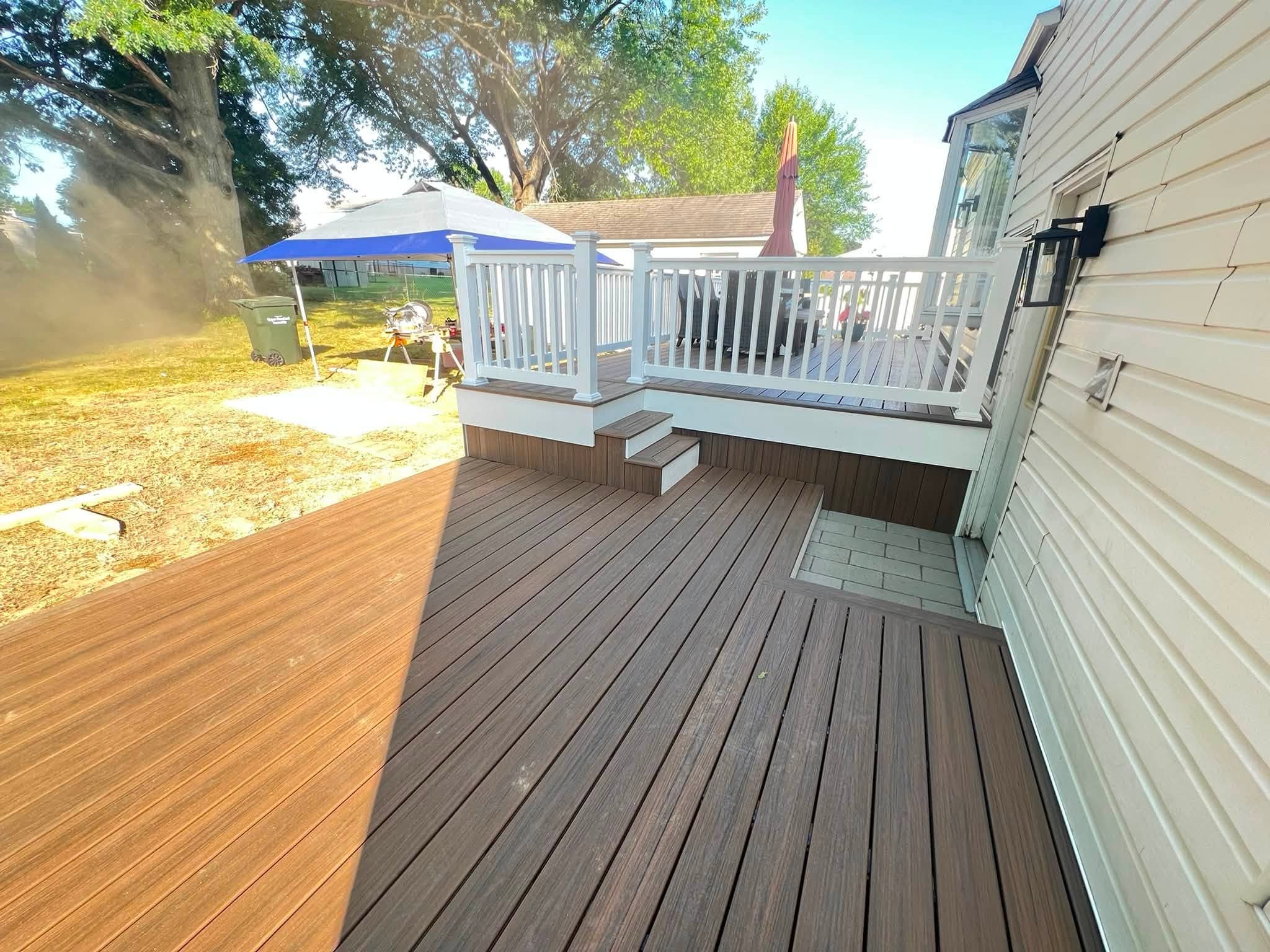 Covered deck with white railings, after view 3