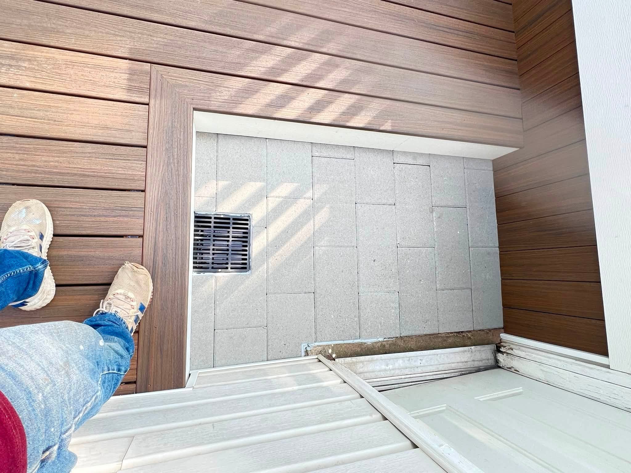 Covered deck with white railings, after view 4