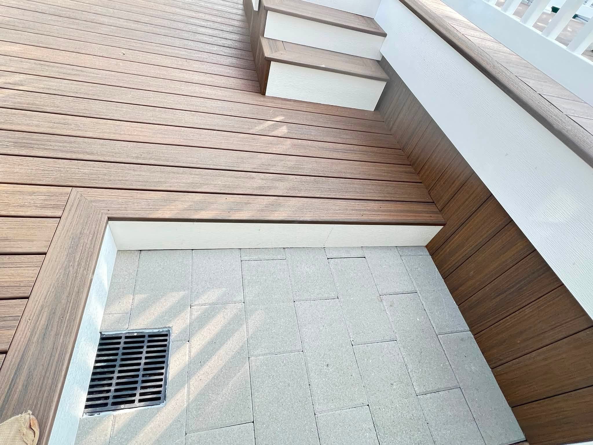 Covered deck with white railings, after view 5