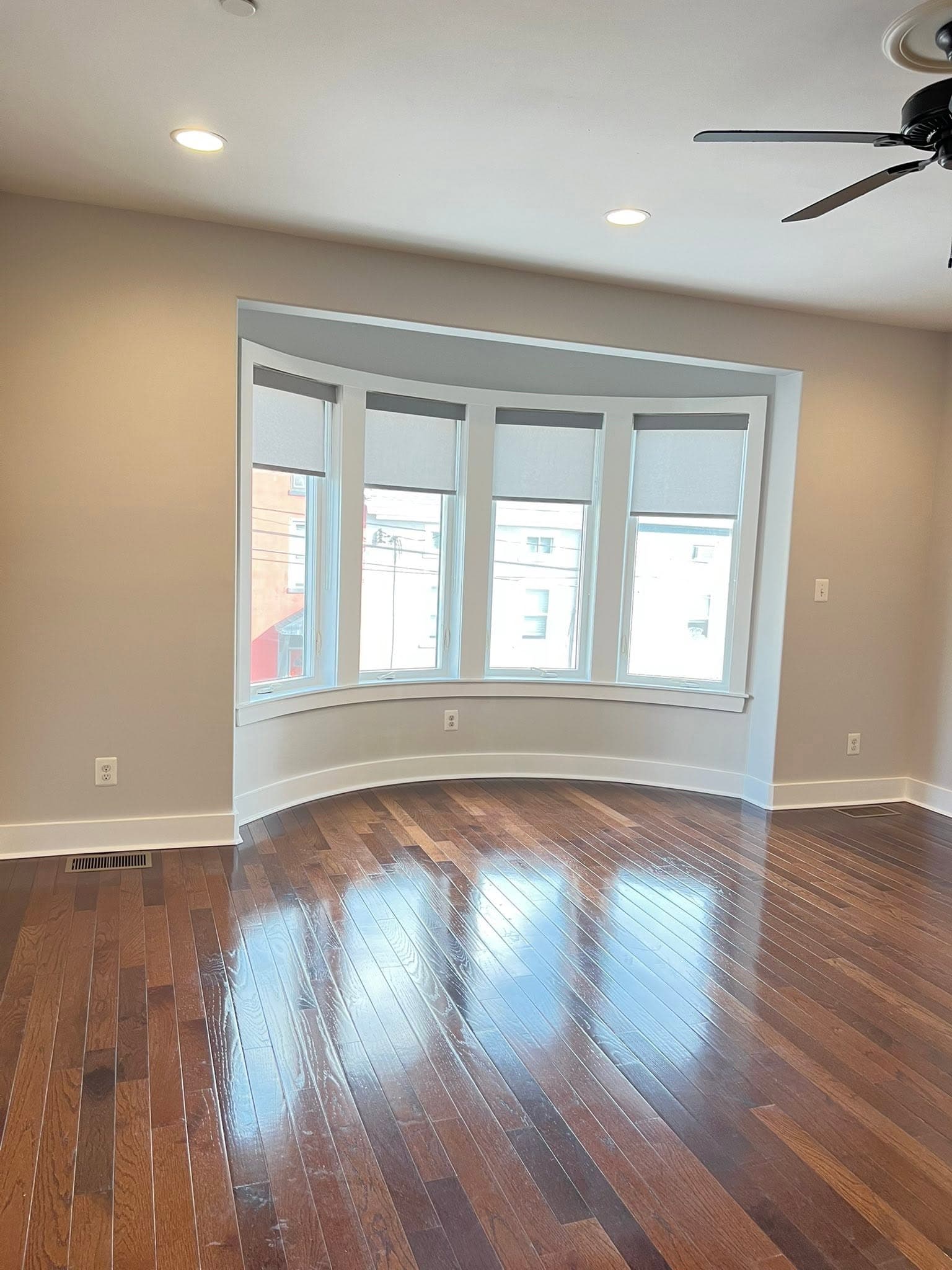 Light-painted interior with dark wood flooring, after view 4