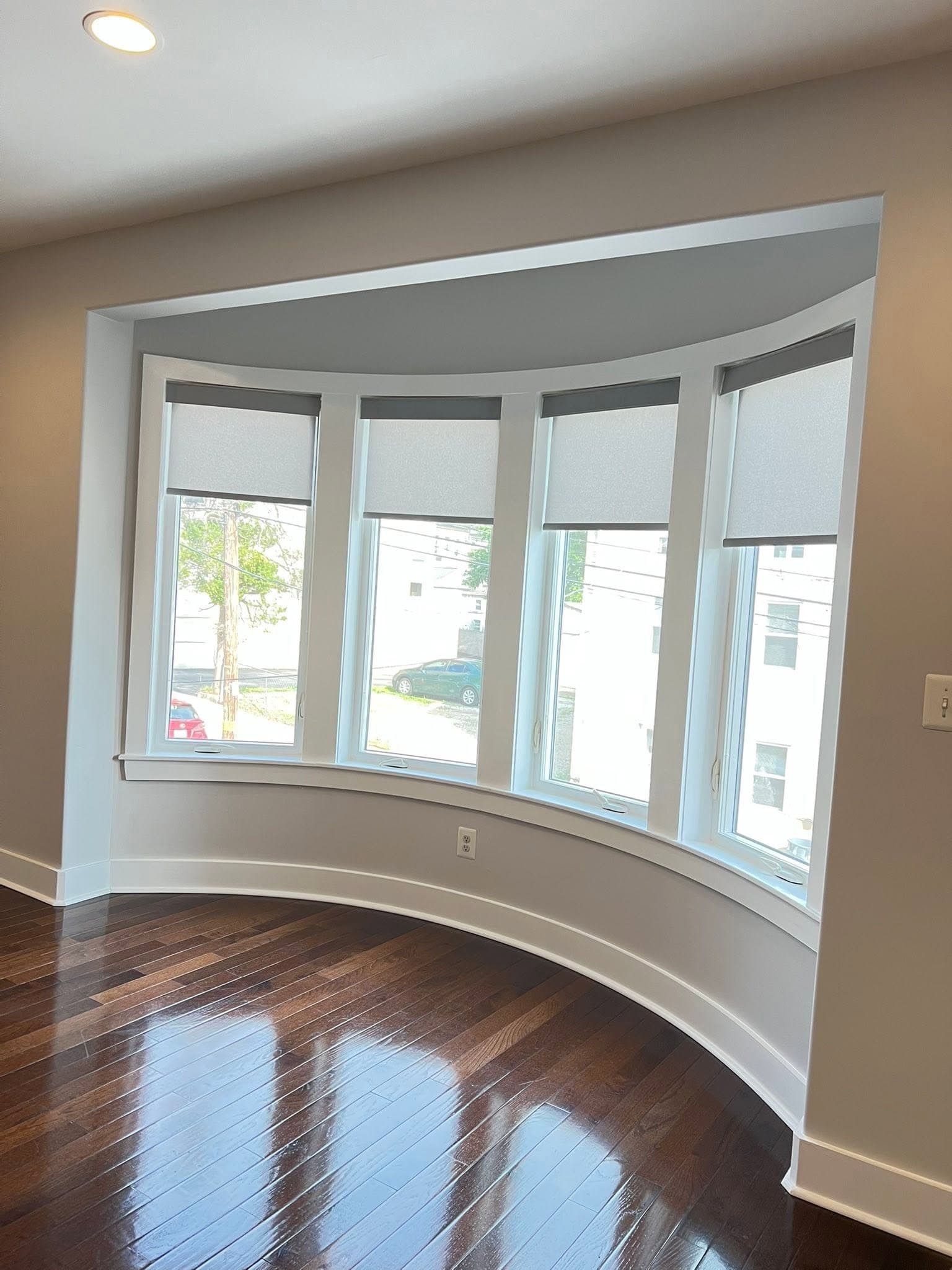 Light-painted interior with dark wood flooring, after view 5