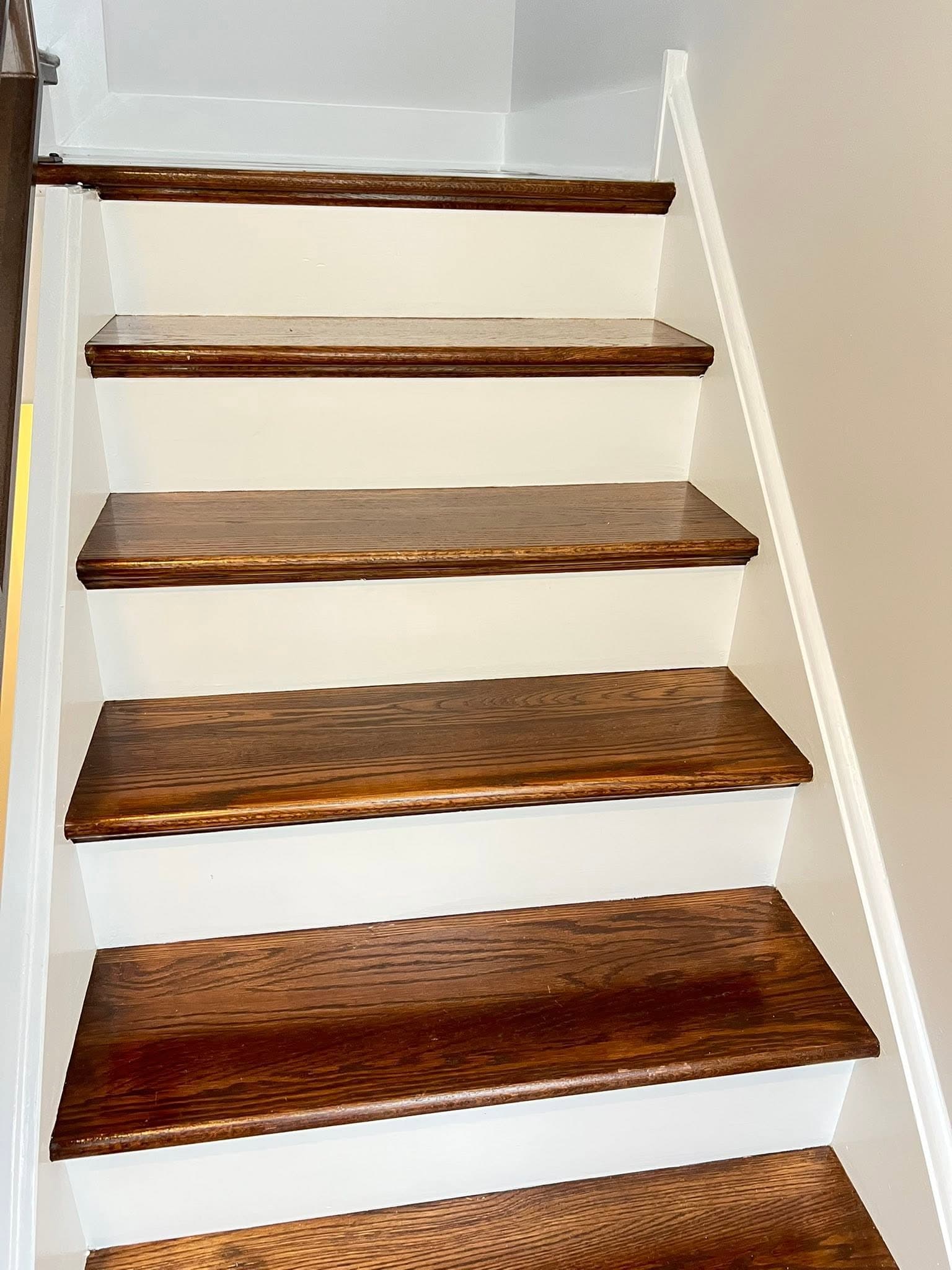 Light-painted interior with dark wood flooring, after view 7
