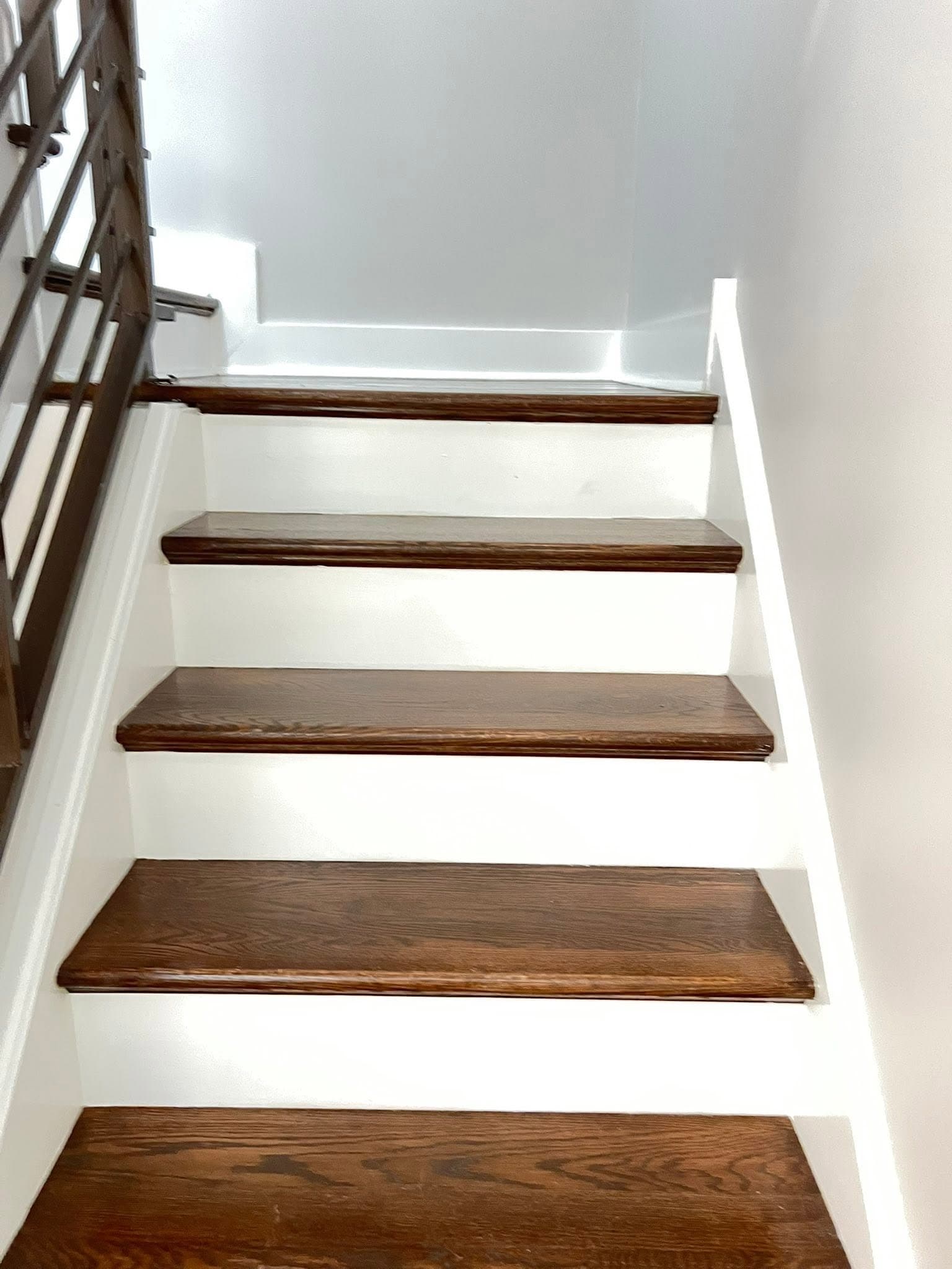 Light-painted interior with dark wood flooring, after view 8