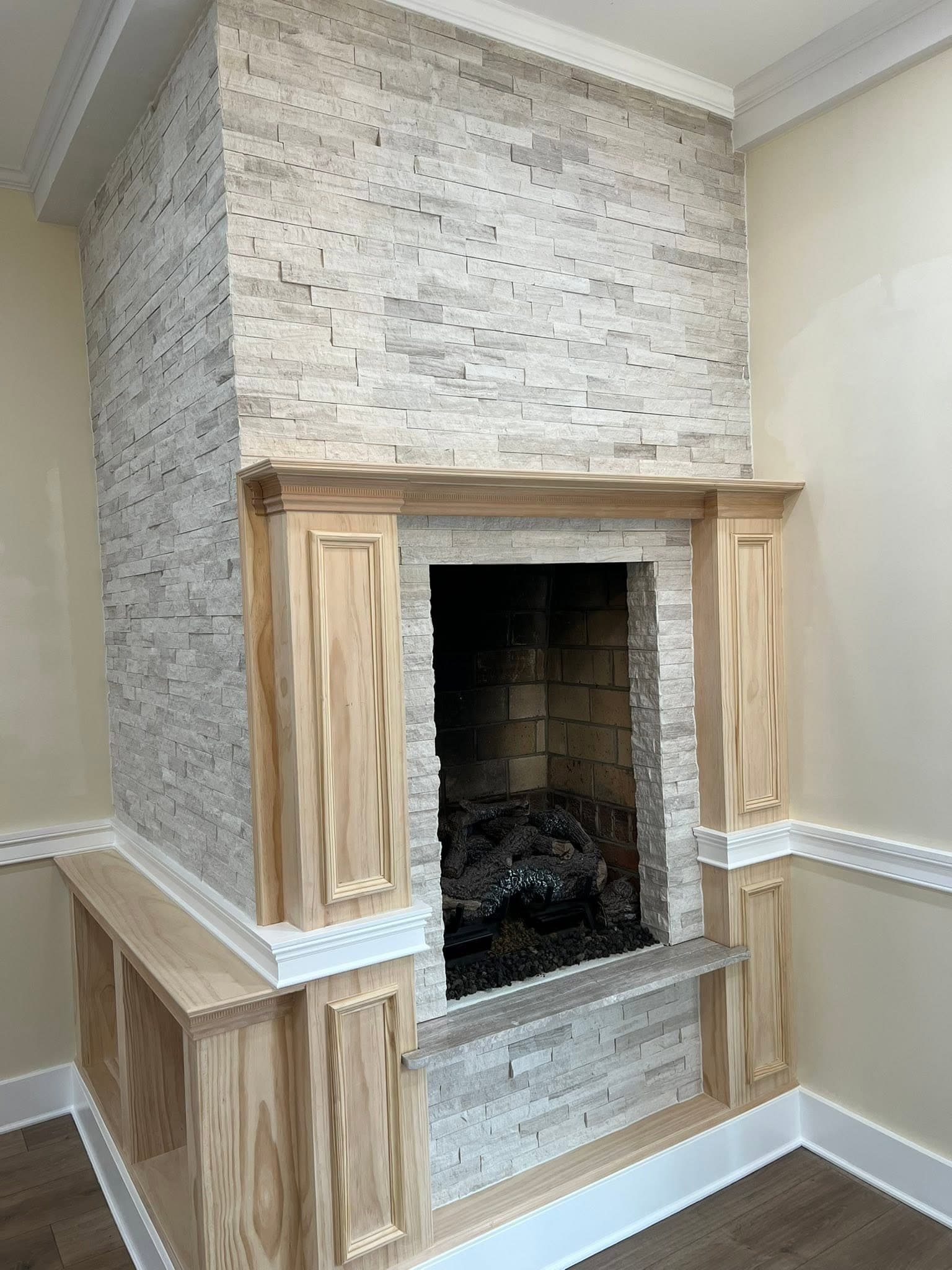 Room with stone-faced fireplace, after view 5