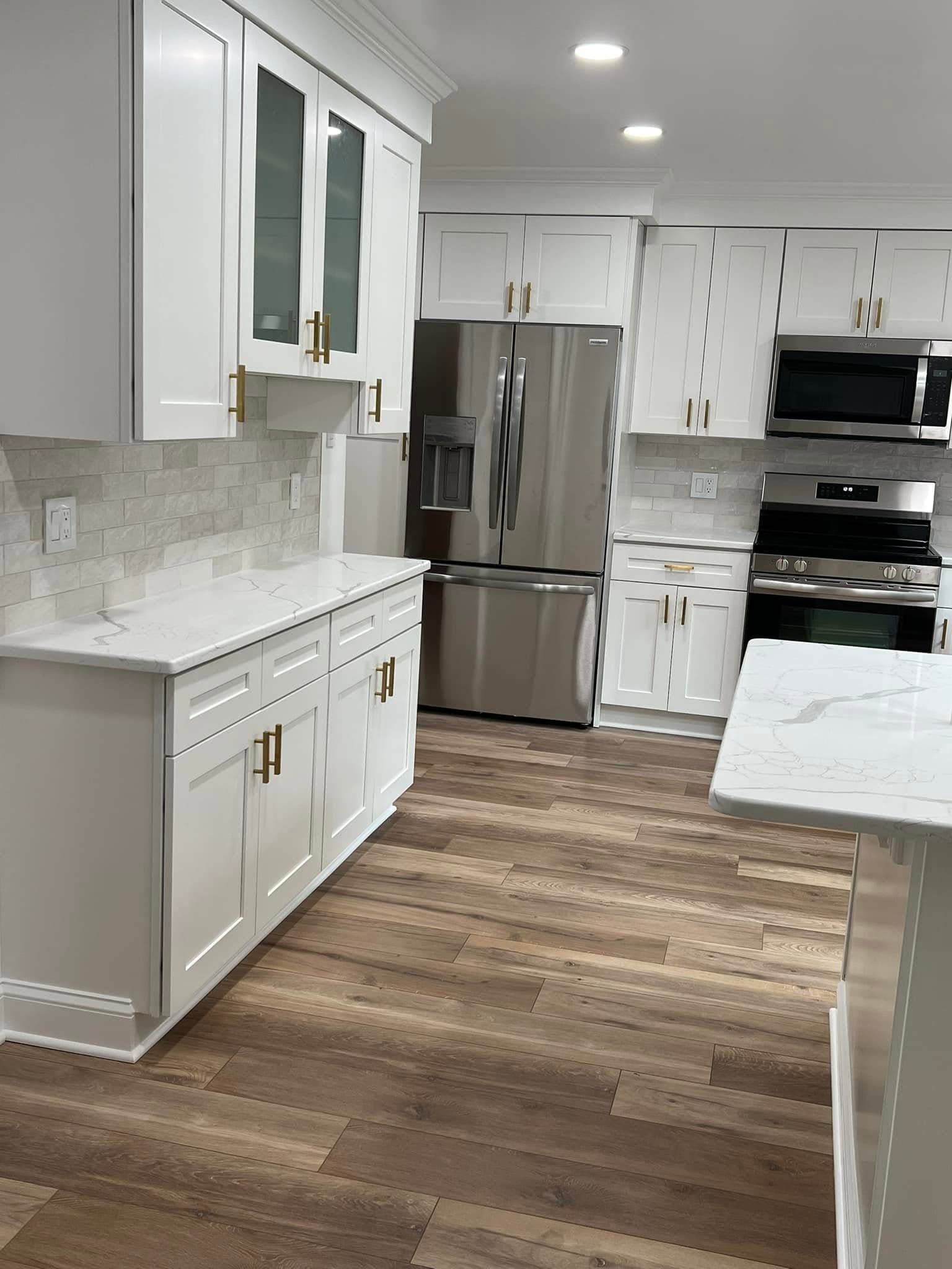 Kitchen with white cabinetry, after view 2