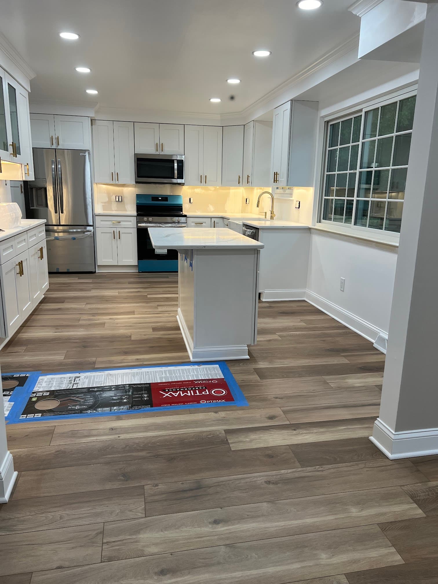 Kitchen with white cabinetry, after view 3