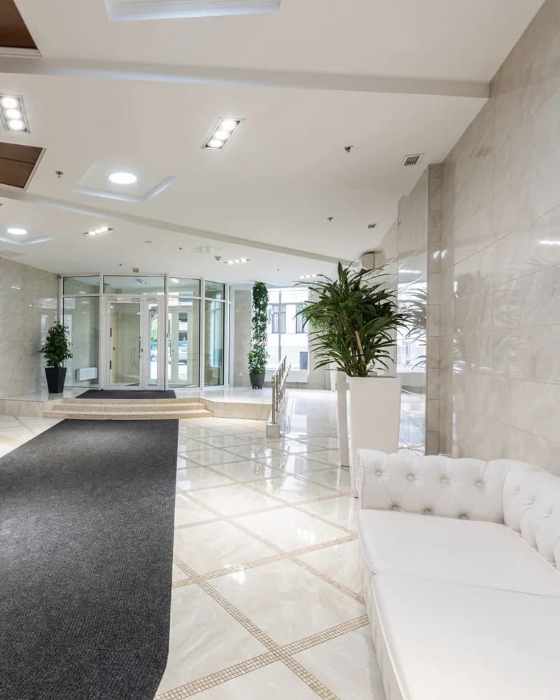Bright finished commercial lobby with white walls