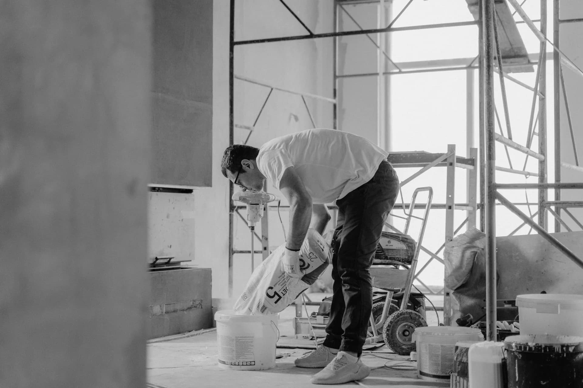 Worker in an unfinished renovation space