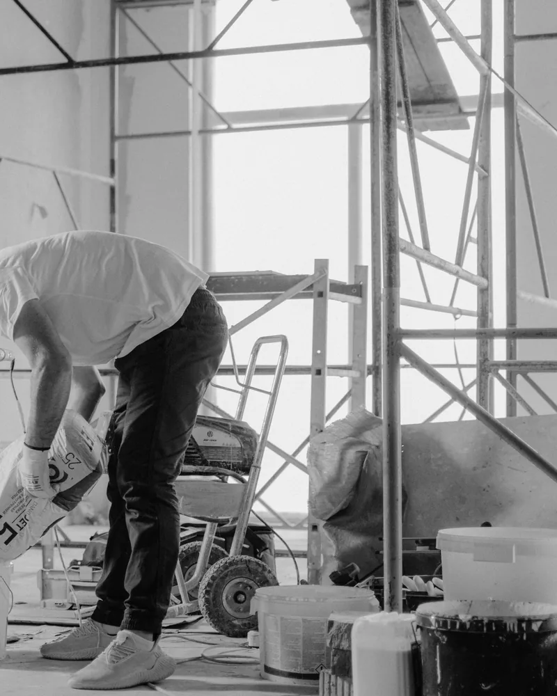 Worker in an unfinished renovation space