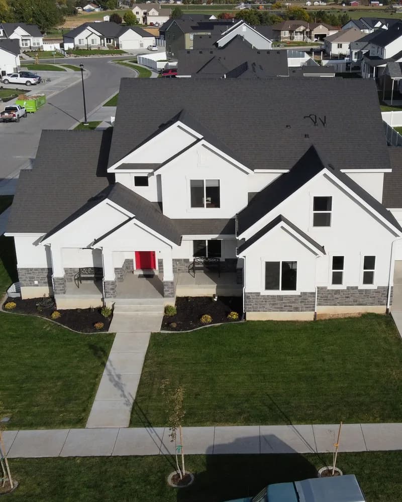 Aerial view of a modern white suburban home