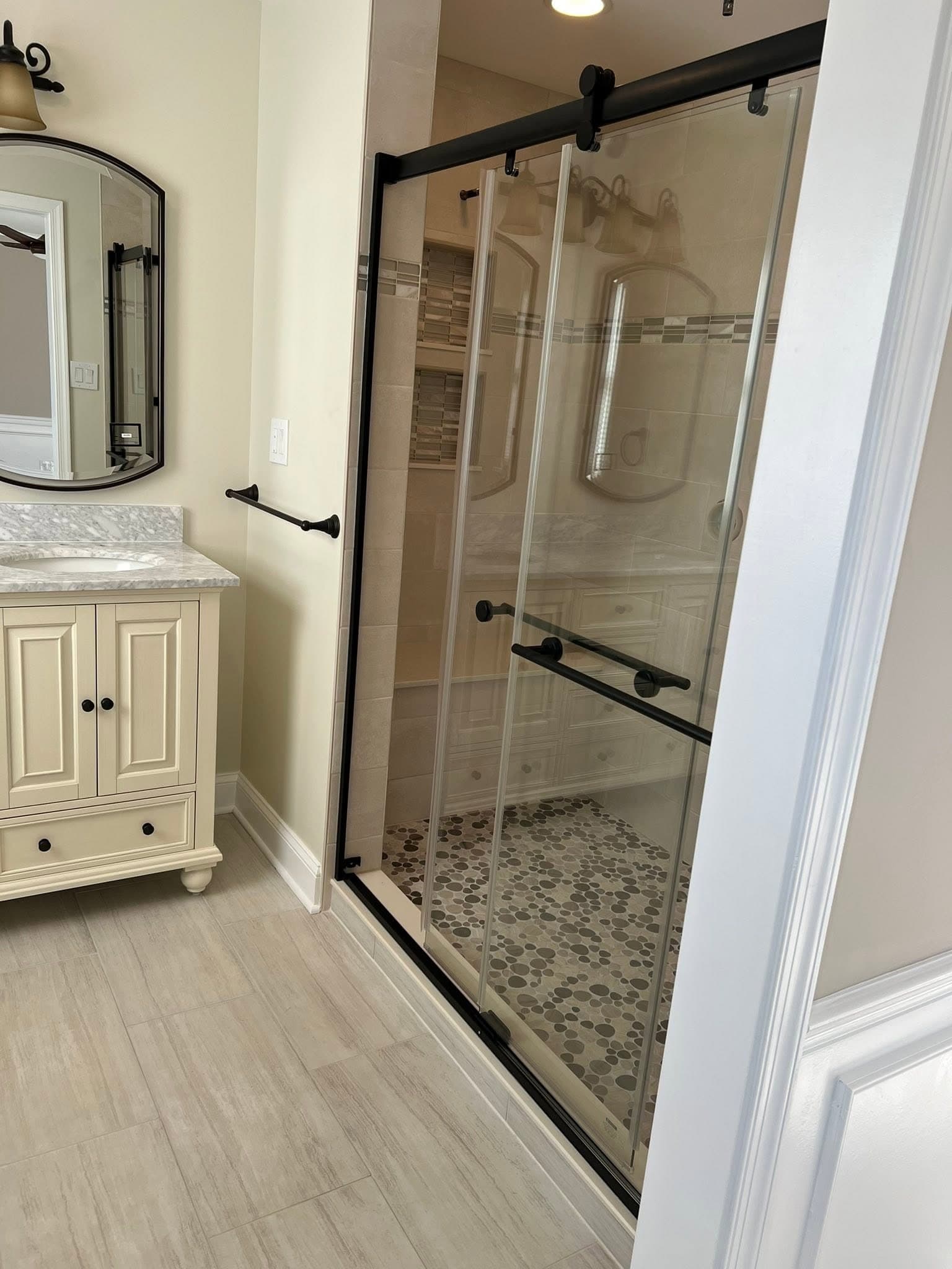 Bathroom with glass shower, after view 1