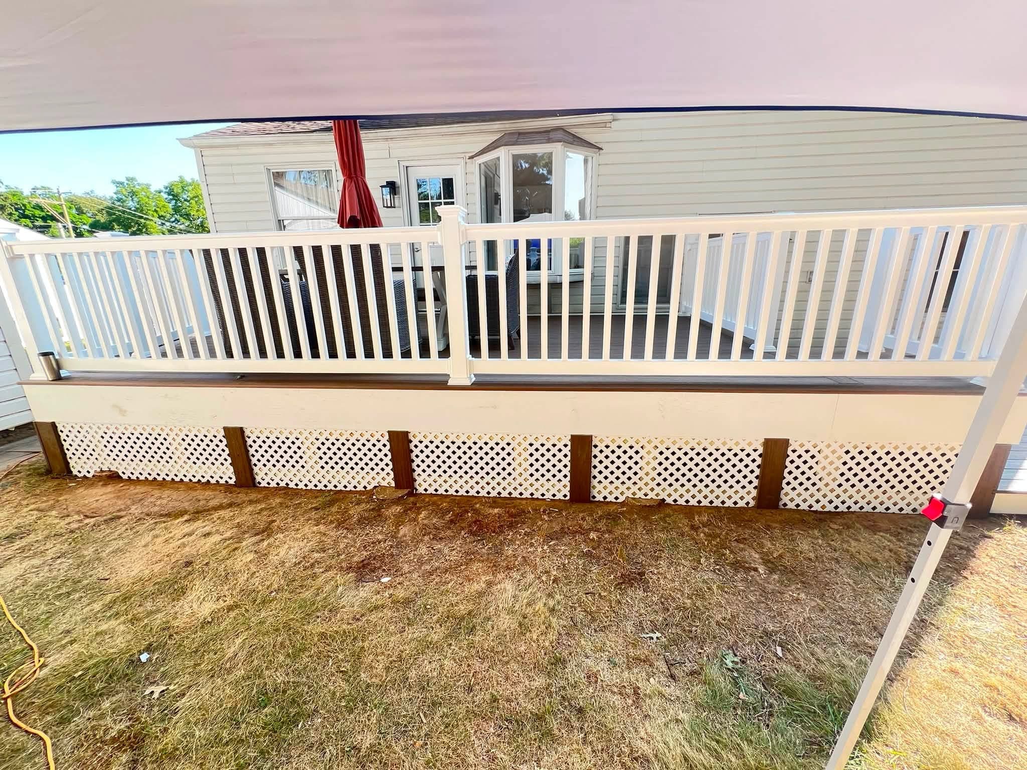 Covered deck with white railings, after view 1