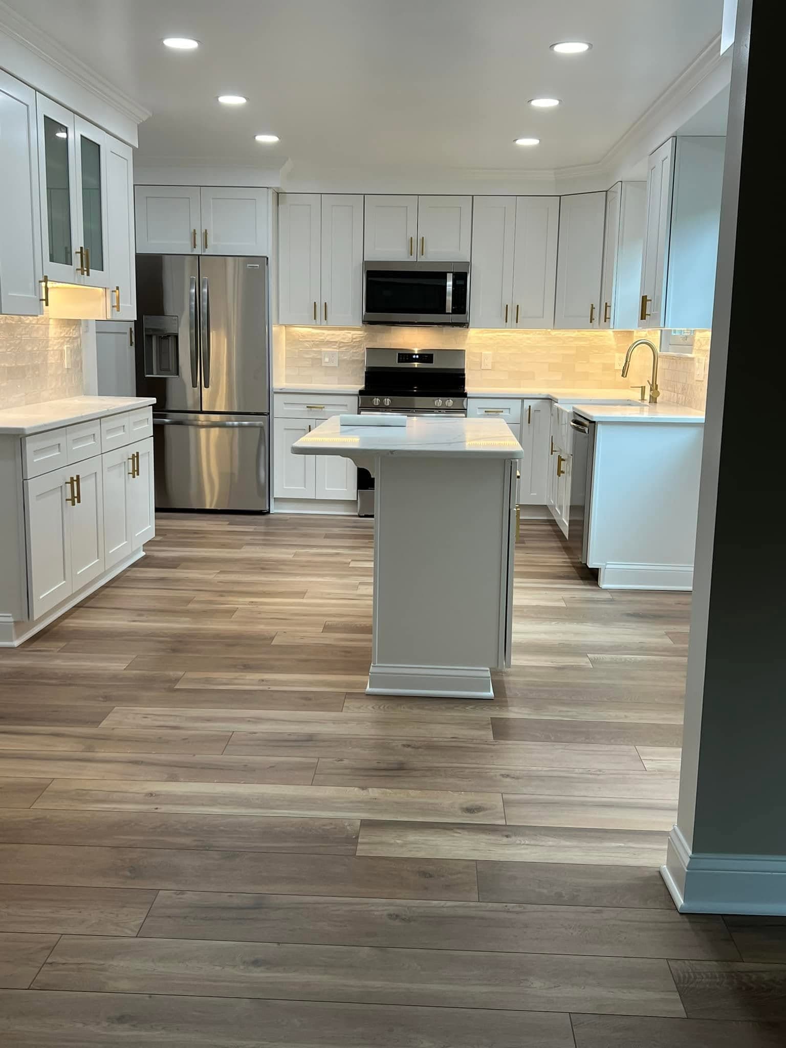 Kitchen with white cabinetry, after view 1